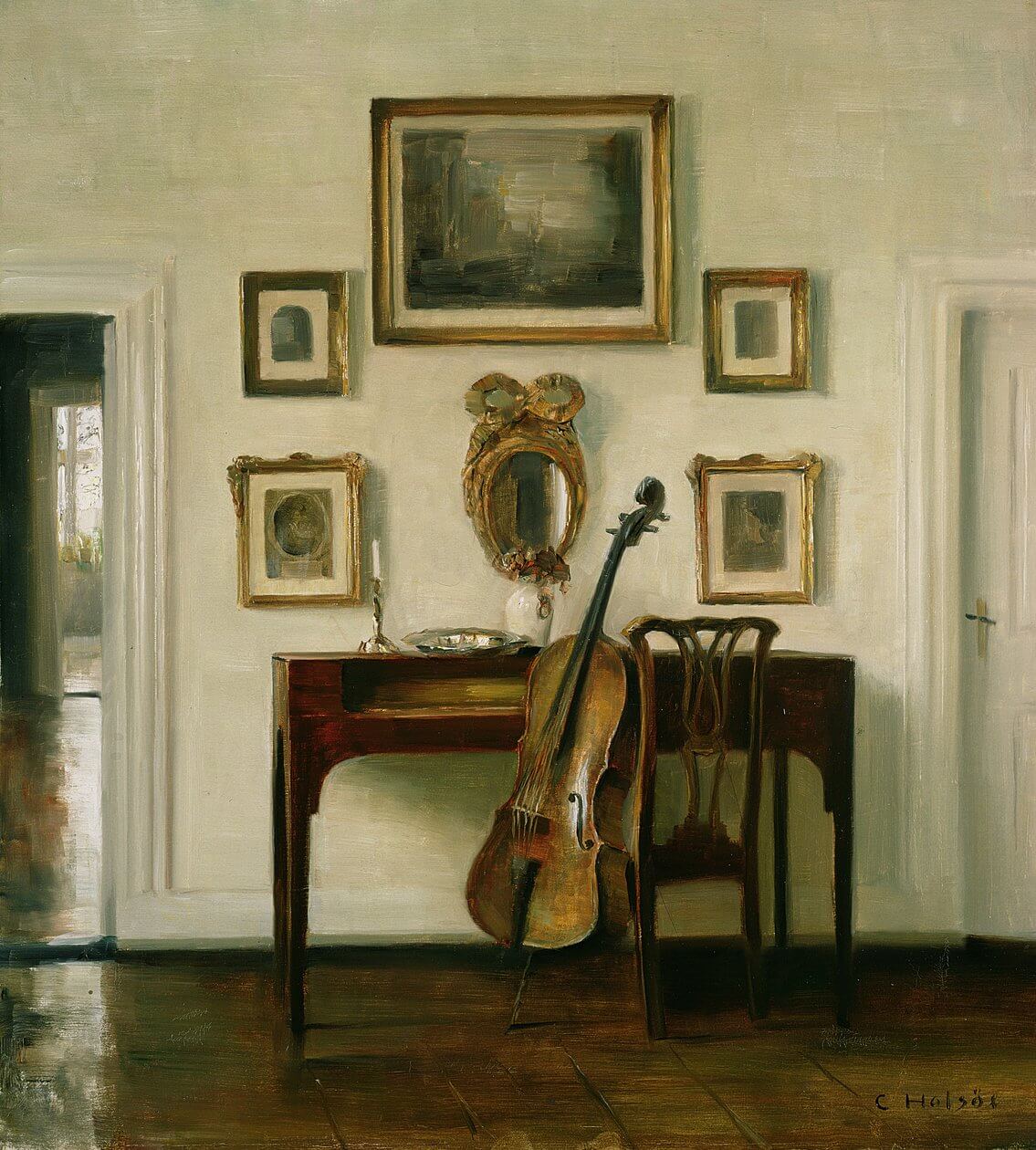 A collection of fine violins and cellos in a music room
