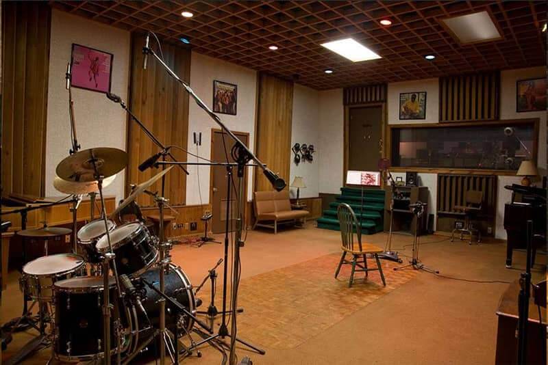 A professional drum kit in a soundproofed studio room